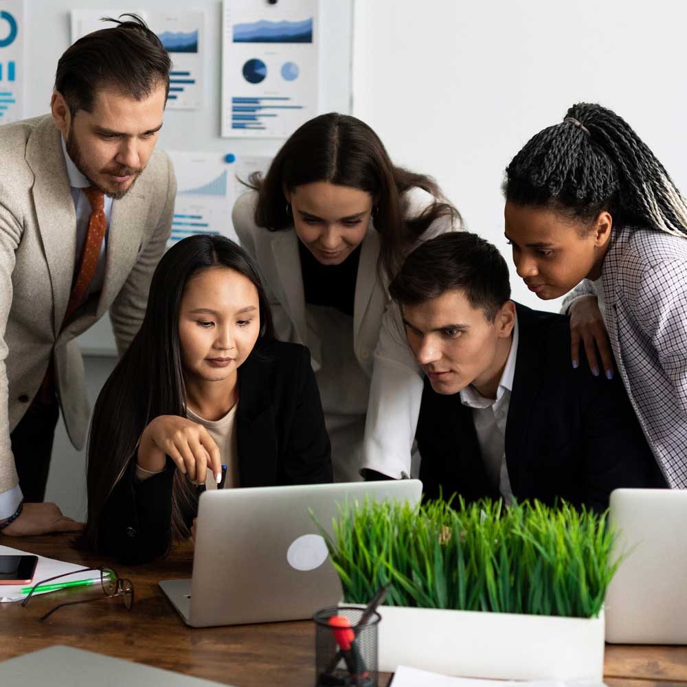 Mixed race business associates discussing new project plan in modern office